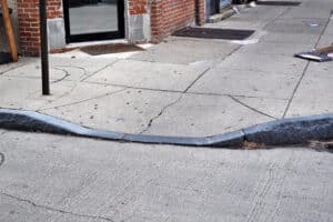 an elevated side walk with a lowered area for easier accessibility to access it