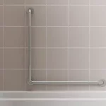 L-shaped grab bar on a tile wall in a bath/shower combo.